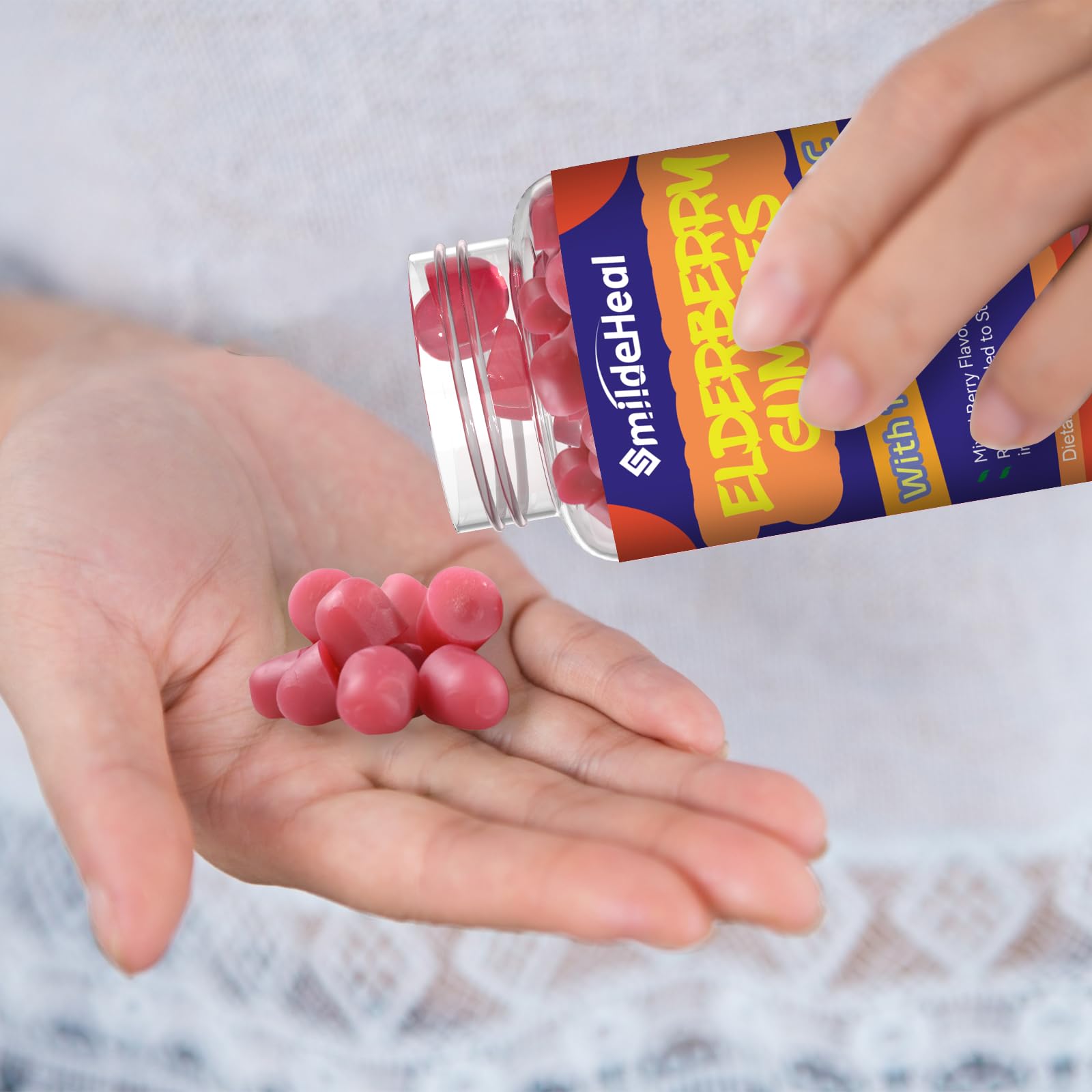 SmildeHeal Elderberry Gummies in a hand for size reference