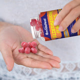 SmildeHeal Elderberry Gummies in a hand for size reference