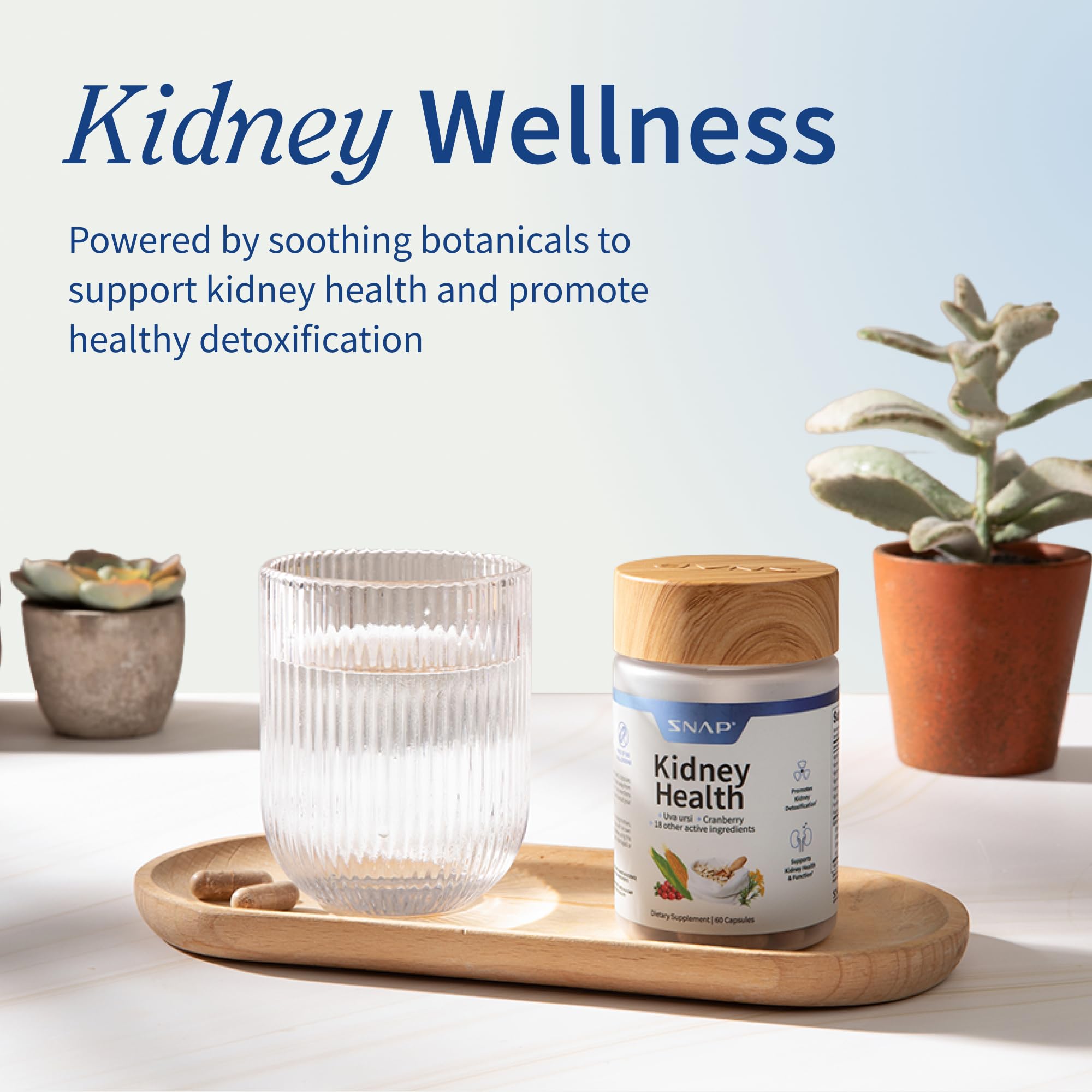 Snap Supplements Liver & Kidney Health Bundle with a glass of water