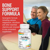 SOLARAY Comprehensive Bone Support Supplement capsules on a wooden surface