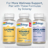 SOLARAY L-Lysine 500mg supplement next to a glass of water