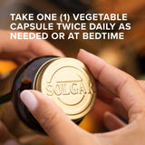 Solgar 5-HTP capsules on a wooden surface