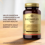 Solgar B-Complex 100 Capsules on a wooden table with natural lighting
