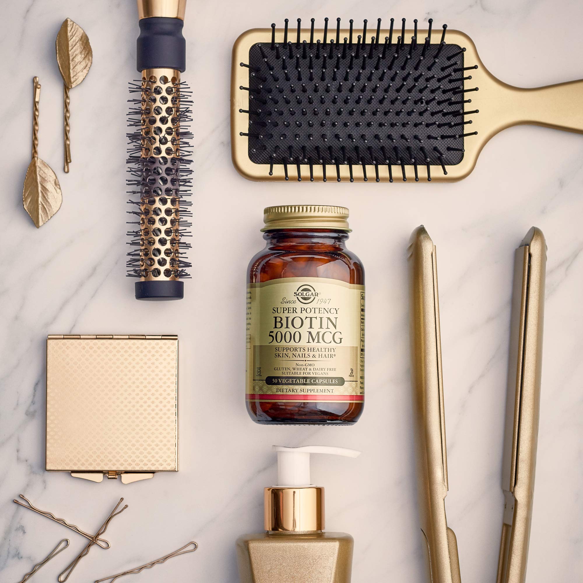 Solgar Biotin 10,000 mcg capsules on a wooden table