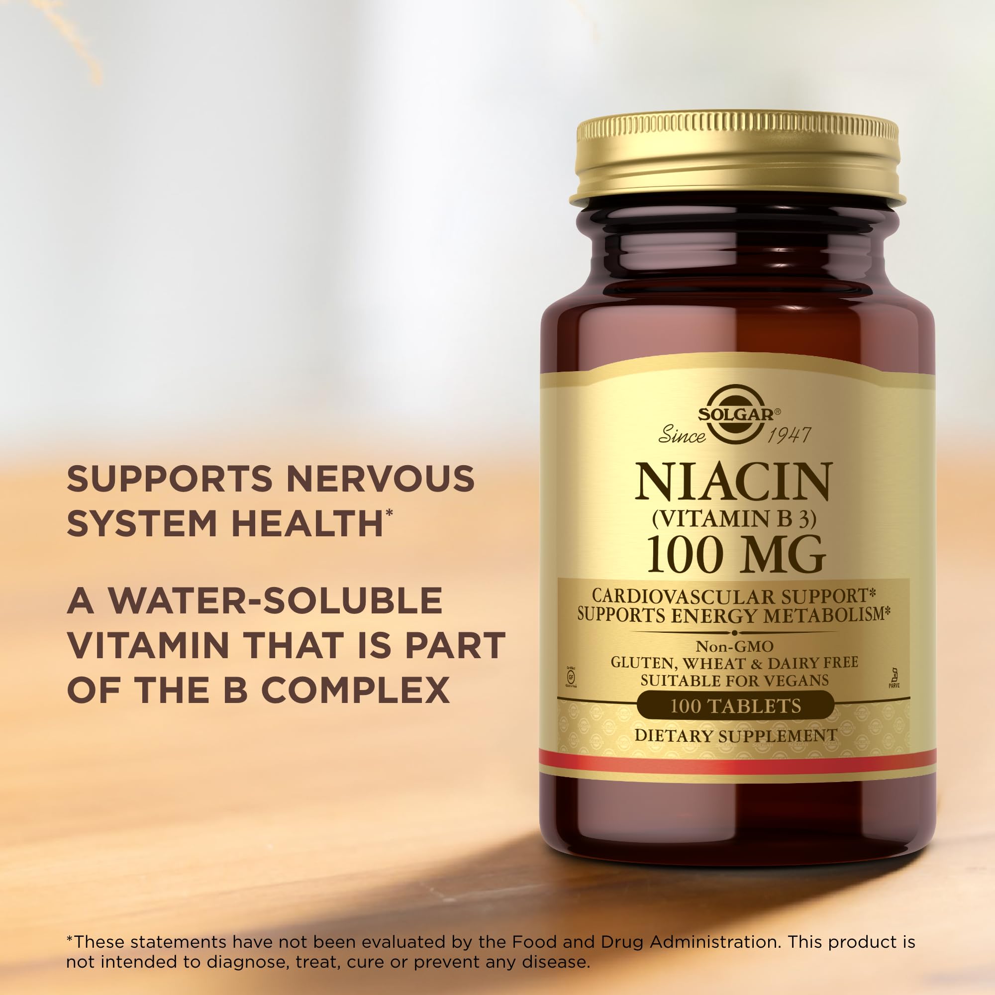 Solgar Niacin B3 100mg Supplement capsules on a wooden surface
