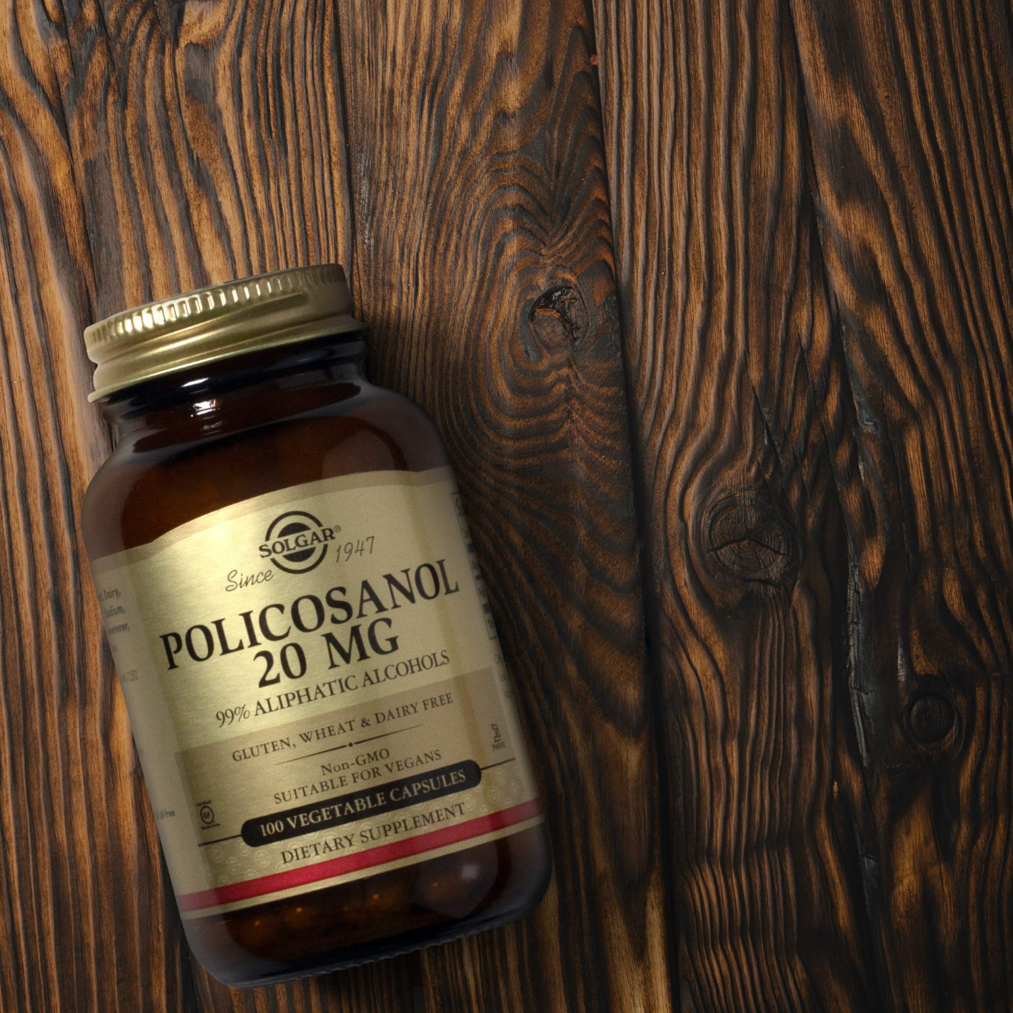 Solgar Policosanol 20 mg Vegetable Capsules on a wooden table