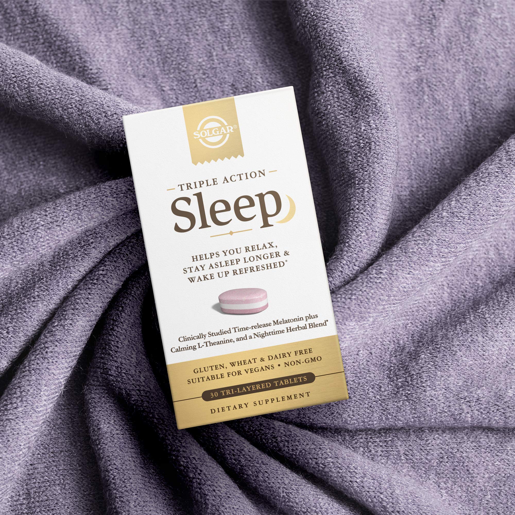 Solgar Triple Action Sleep bottle with a measuring spoon