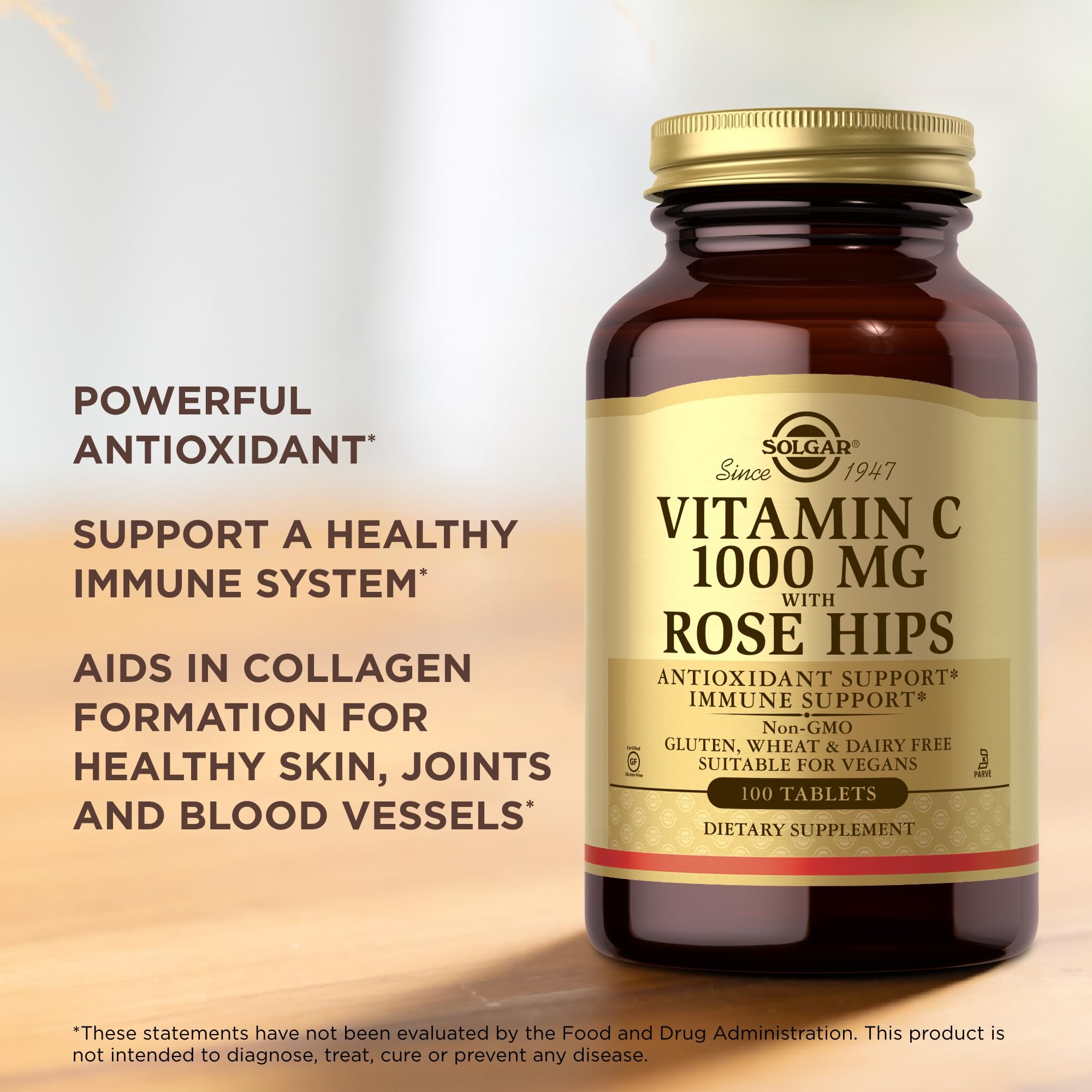 Solgar Vitamin C 1000 mg with Rose Hips tablets on a wooden surface