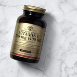 Solgar Vitamin E 260g softgels with a measuring spoon