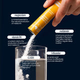 Som Sleep Restorative Sleep Drink Mix powder in a glass of water