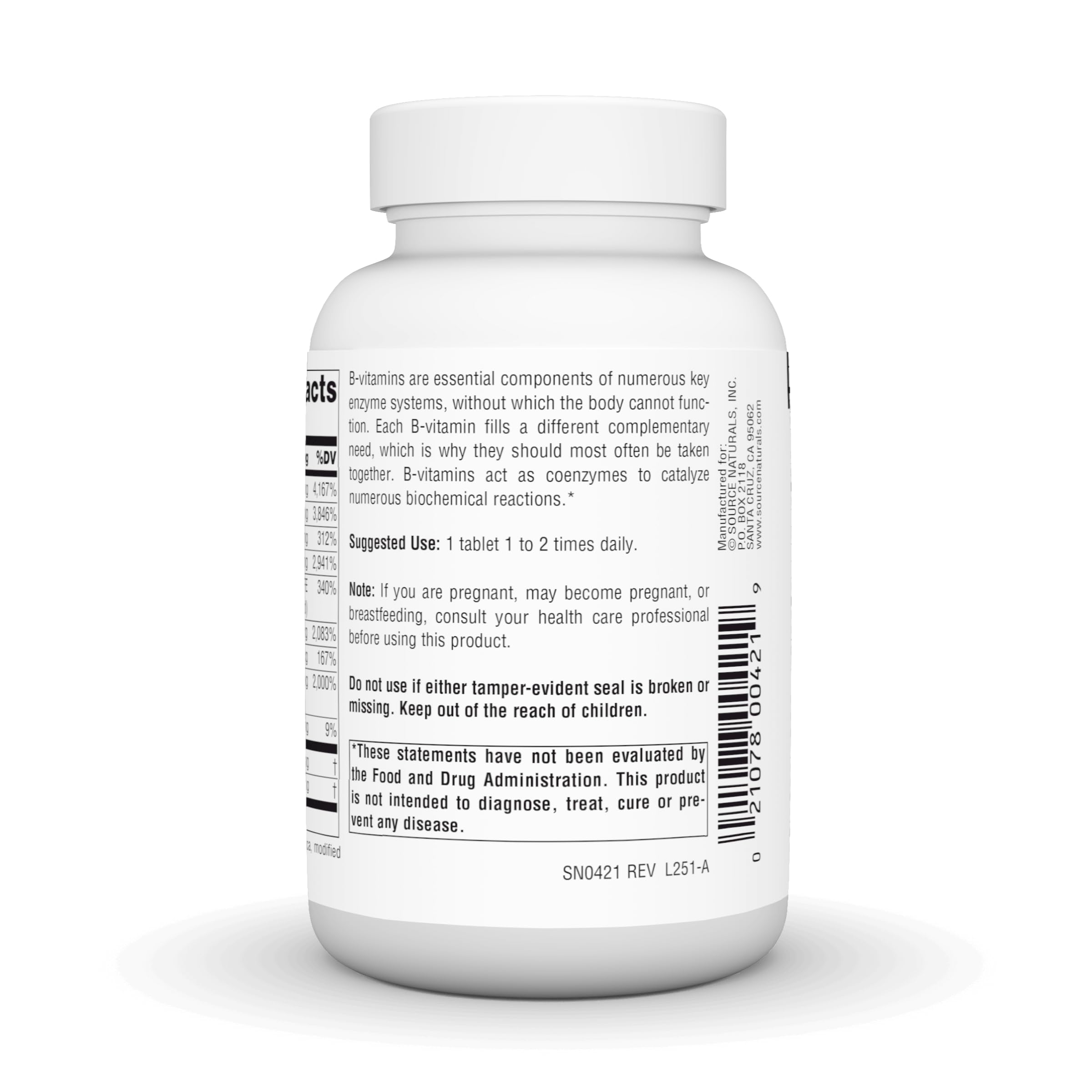 Source Naturals B-Complex tablets on a wooden surface
