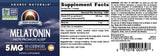 Source Naturals Melatonin 5 mg Orange Lozenges with a hand holding