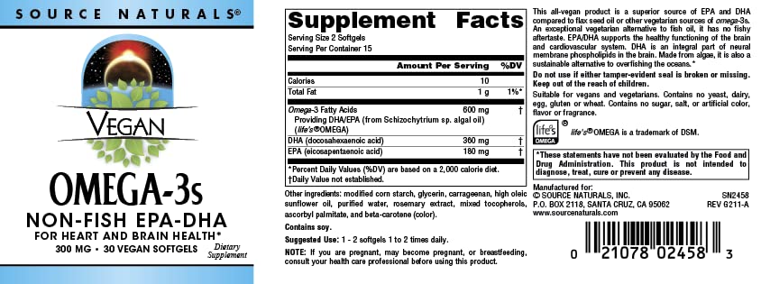 Source Naturals Omega-3 Softgels on a wooden table with a glass of water