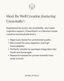 Spoonful of Be Well Creatine Monohydrate powder on a table