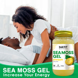 Spoonful of MAX FIT Sea Moss Gel on a wooden table