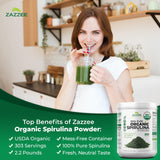 Spoonful of Zazzee Spirulina Powder on a wooden table