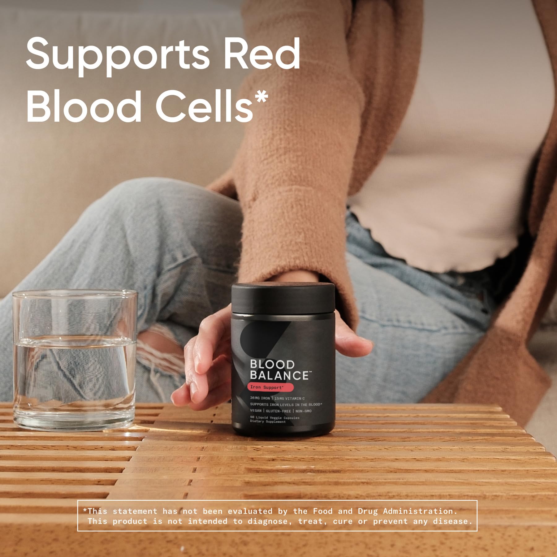 Sports Research Blood Balance Iron Support Supplement on a wooden table