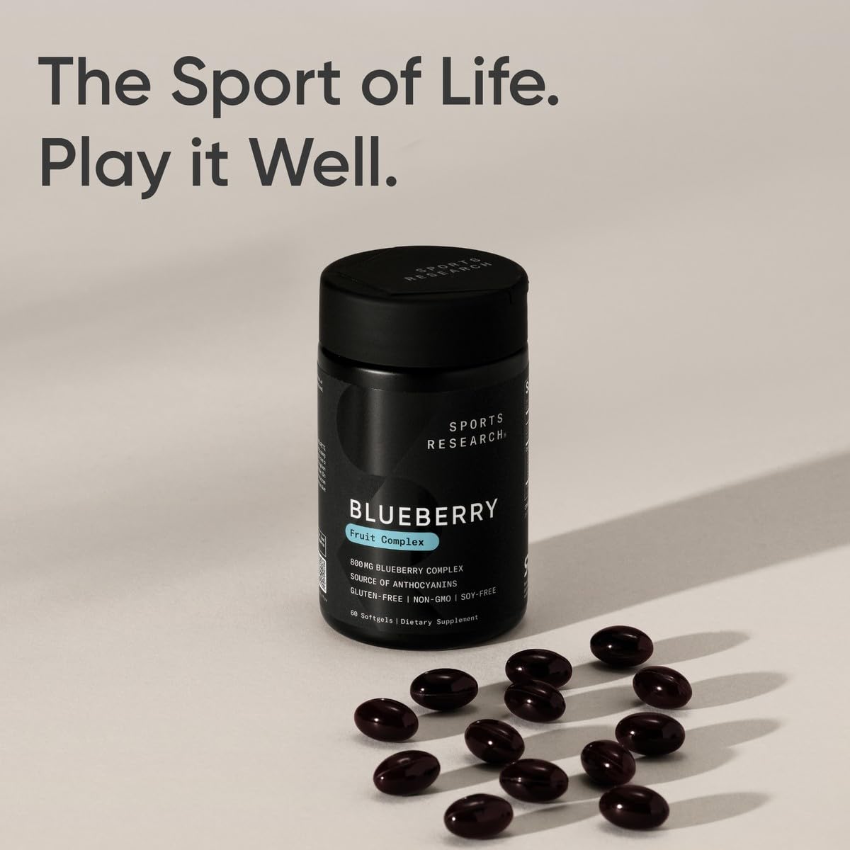 Sports Research Blueberry Fruit Complex softgel capsules alongside a measuring spoon