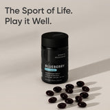 Sports Research Blueberry Fruit Complex softgel capsules alongside a measuring spoon