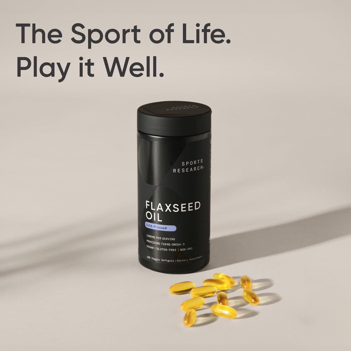 Sports Research Flaxseed Oil bottle with a measuring spoon