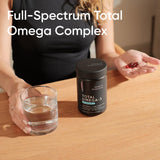 Sports Research Krill Oil Omega-3 Supplement softgels in a hand