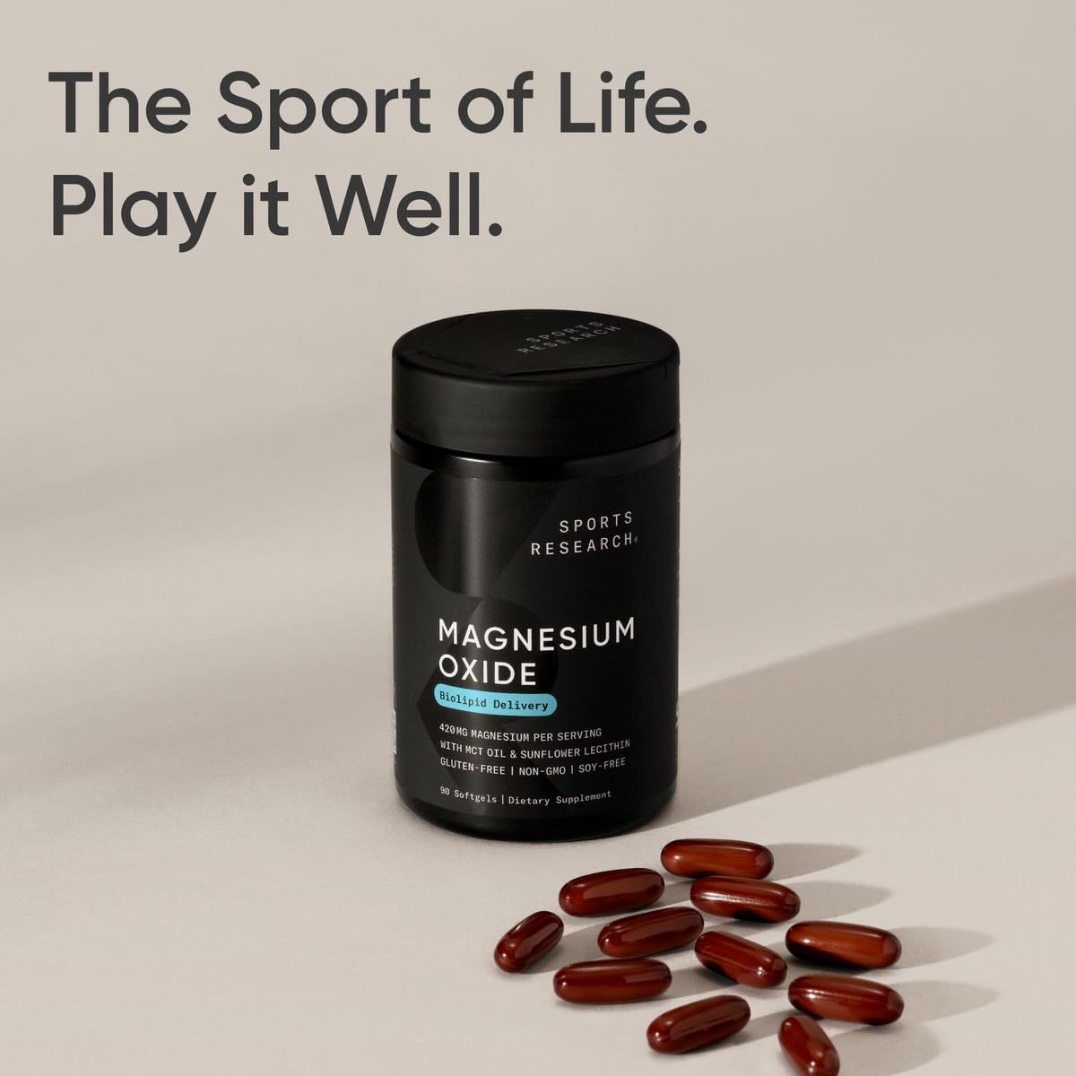 Sports Research Magnesium Supplement softgels on a wooden table