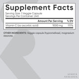 Sports Research Vitamin C 1000mg vegan capsules on a wooden table