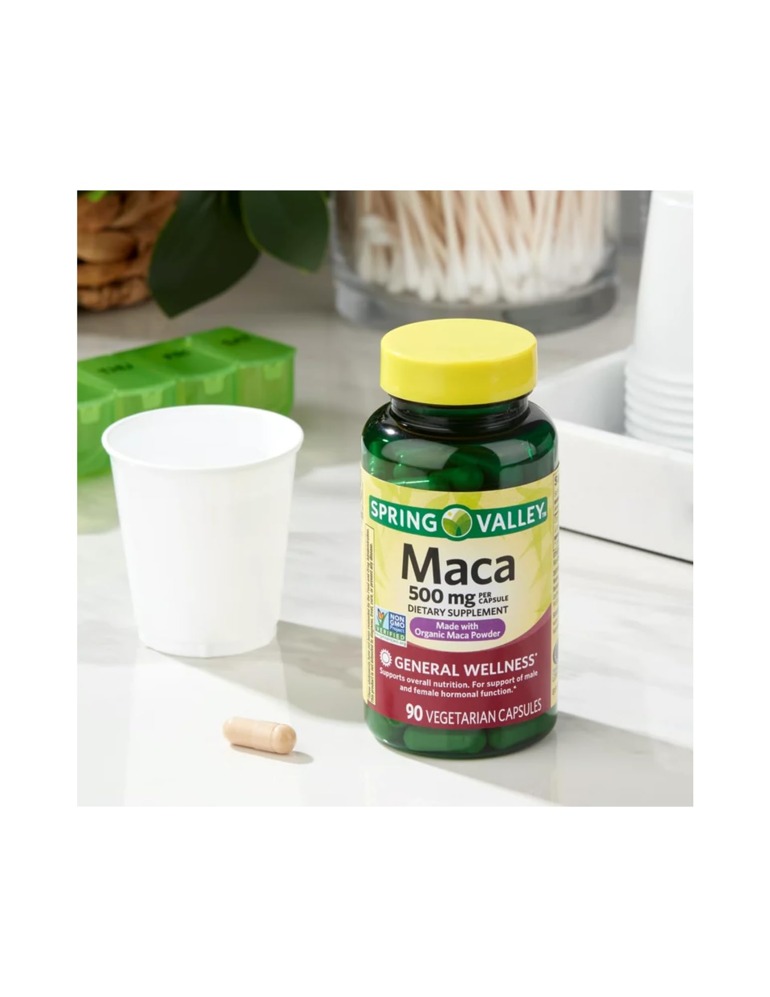 Spring Valley Maca capsules on a wooden table