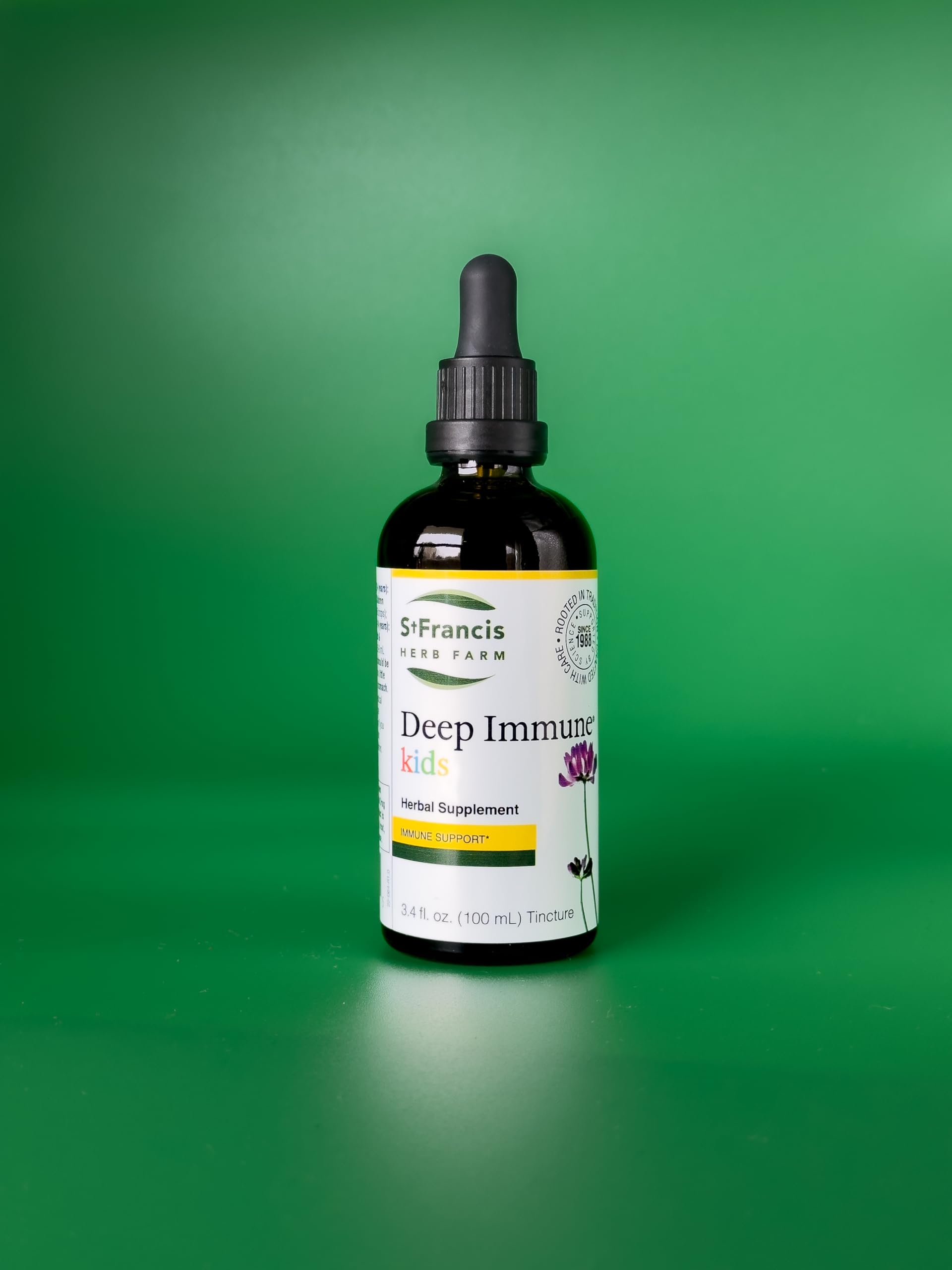 St. Francis Herb Farm Deep daily wellness Kids 3.38 fl. oz. bottle with herbs in background