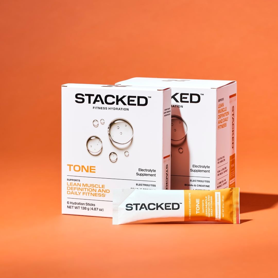 STACKED FITNESS HYDRATION Electrolyte and Creatine Packets mixed in a glass