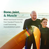 Standard Process Inc. Skeleton Nutrition Support Supplement on a kitchen counter
