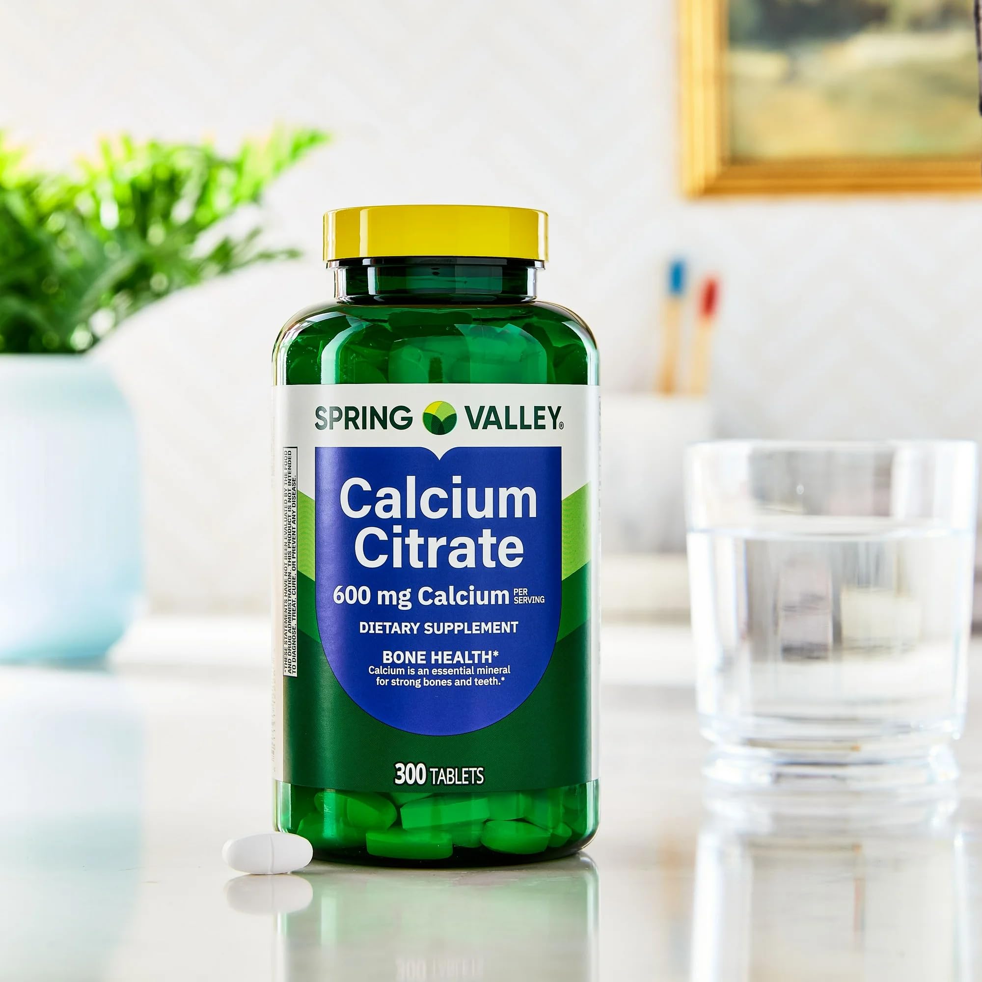 STS Home Calcium Citrate Tablets 600mg displayed on a wooden table