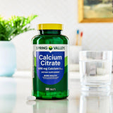 STS Home Calcium Citrate Tablets 600mg displayed on a wooden table