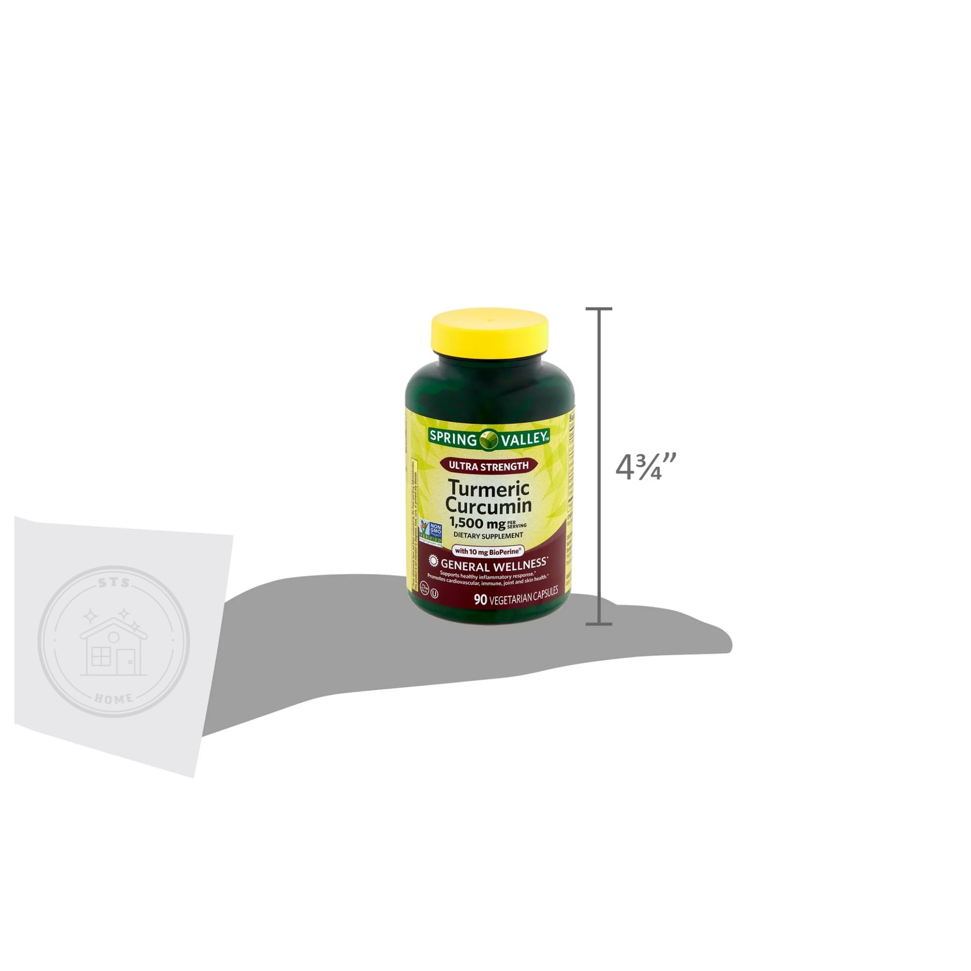 STS Home Turmeric Curcumin Supplement capsules in a hand