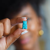 SugarBearHair Biotin Supplement opened with capsules visible