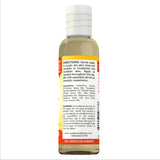 Sundance Vitamin E Skin Care Oil on a wooden surface