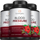 Sunergetic Blood Pressure Support Supplement with a glass of water