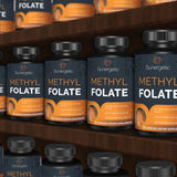 Sunergetic Methyl Folate Supplement with a measuring spoon for dosage