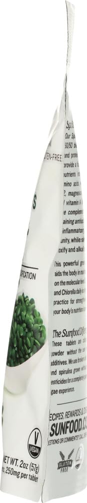Sunfood Superfoods Spirulina & Chlorella Capsules on a wooden table