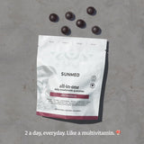 SUNMED Mushroom Blend Supplement 181g displayed with fresh raspberries