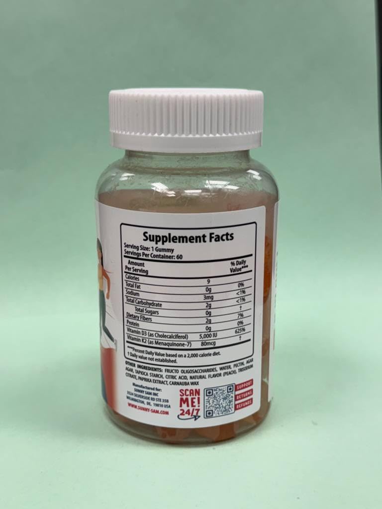 SUNNY SAM Vitamin D3 K2 Gummies 5000 IU Peach flavour with a glass of water