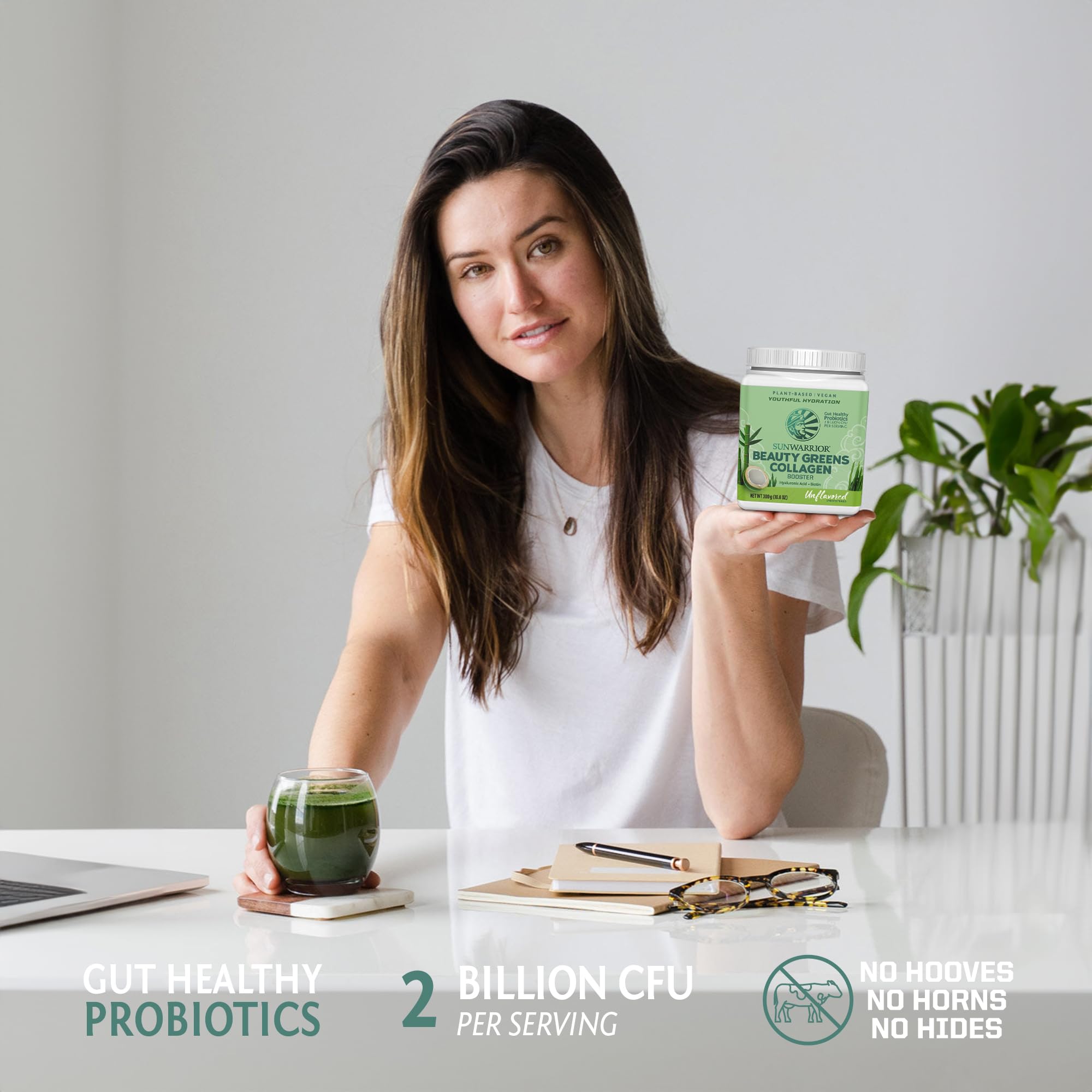 Sunwarrior Beauty Greens Collagen support in a glass with a spoon
