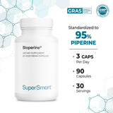 Supersmart Curcumin with Bioperine capsules on a wooden table