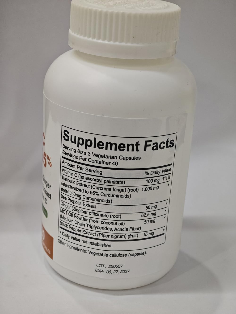 SUUDUUL Turmeric Curcumin 1000 mg bottle with a green plant background