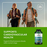 Swanson L-Arginine 500mg capsules on a wooden table