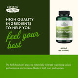 Swanson Muira Puama Root Capsules 400mg on a wooden table