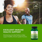 Swanson Ultimate Probiotic Formula capsules on a wooden table