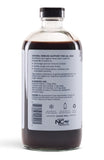 Sweet's Elderberry Syrup pouring into a spoon
