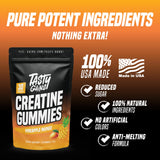 TASTY GAINS Creatine Gummies on a wooden table