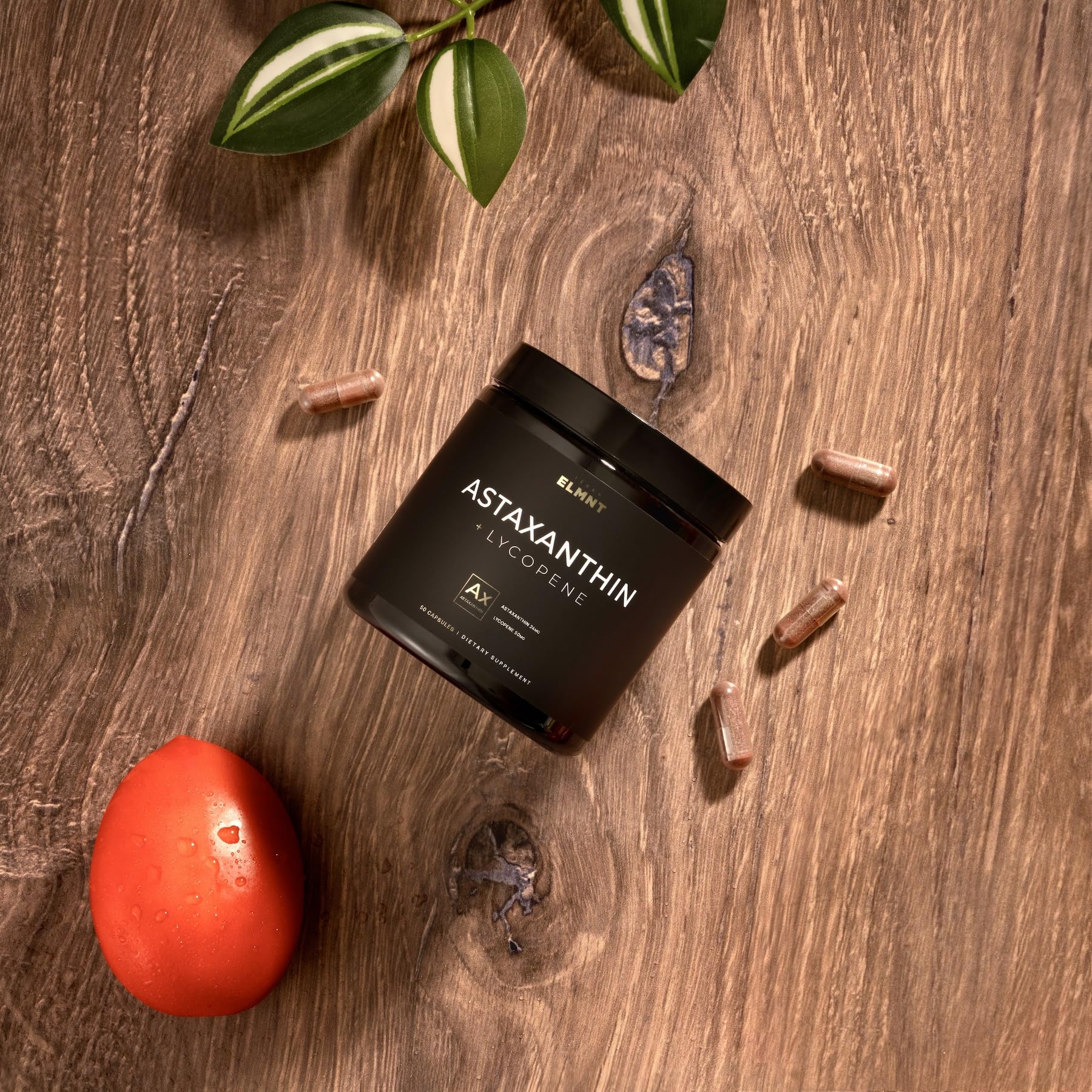 TERRA ELMNT Astaxanthin & Lycopene Supplement bottle on a wooden table